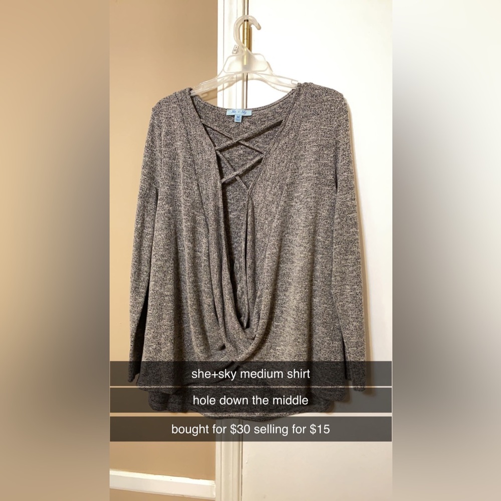 sweater with hood going down middle